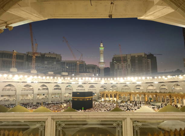 istock Wide angle view of pilgrim circumambulation around Al Haram Mosque or Kaaba (Grand Mosque) and performing Umrah or Hajj at night in Mecca (Makkah), Saudi Arabia. 2185677761