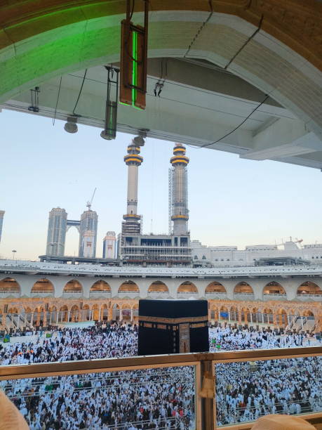 istock Wide angle view of pilgrim circumambulation around Al Haram Mosque or Kaaba (Grand Mosque) and performing Umrah or Hajj at daytime in Mecca (Makkah), Saudi Arabia. 2185677768