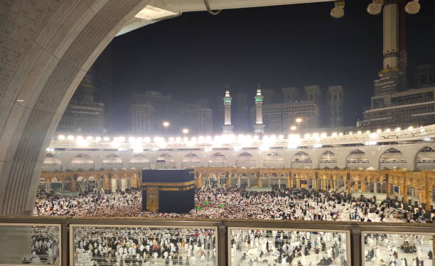 istock Wide angle view of pilgrim circumambulation around Al Haram Mosque or Kaaba (Grand Mosque) and performing Umrah or Hajj at night in Mecca (Makkah), Saudi Arabia. 2185677775