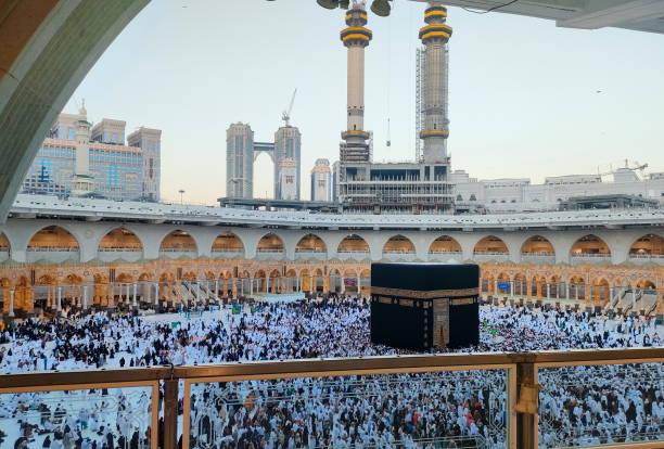 istock Wide angle view of pilgrim circumambulation around Al Haram Mosque or Kaaba (Grand Mosque) and performing Umrah or Hajj at daytime in Mecca (Makkah), Saudi Arabia. 2185677779