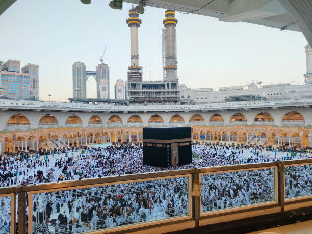istock Wide angle view of pilgrim circumambulation around Al Haram Mosque or Kaaba (Grand Mosque) and performing Umrah or Hajj at daytime in Mecca (Makkah), Saudi Arabia. 2185677906