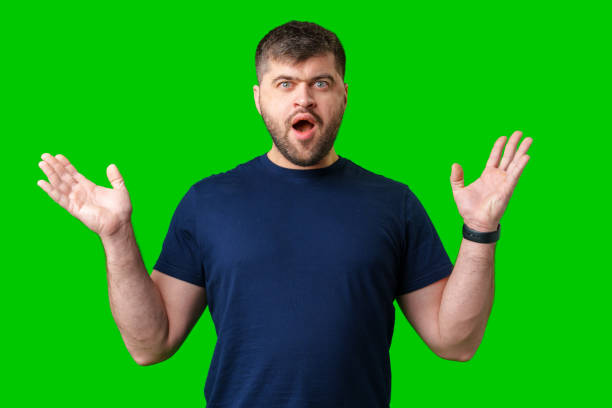 istock A surprised man expresses shock against a bright green background 2185680917
