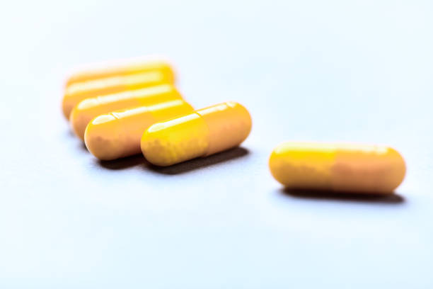 istock Vitamin C capsules. Bright background. Close up. Copy space. 2185682545