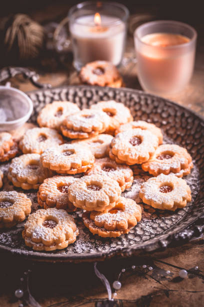 istock Homemade Christmas cookies on kitchen table with  candles 2185682984