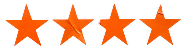 istock A set of orange star shape paper sticker label isolated on white background. 2185684312