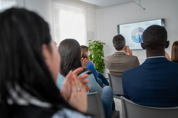 istock Diverse business team meeting presentation conference room professional development training seminar workplace diversity inclusion 2185687502