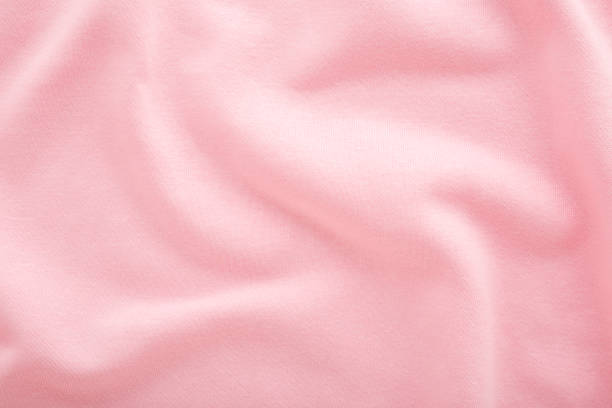 istock Light pink wavy soft knitted fabric background. Empty place for text. Closeup. Top down view. 2185689023