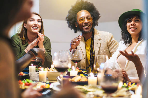 istock Multiracial Friends Enjoying a Warm Dinner Party at Home 2185690294