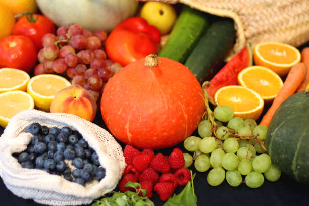 istock Straw Bag And Healthy Produce On Dark Background 2185695834
