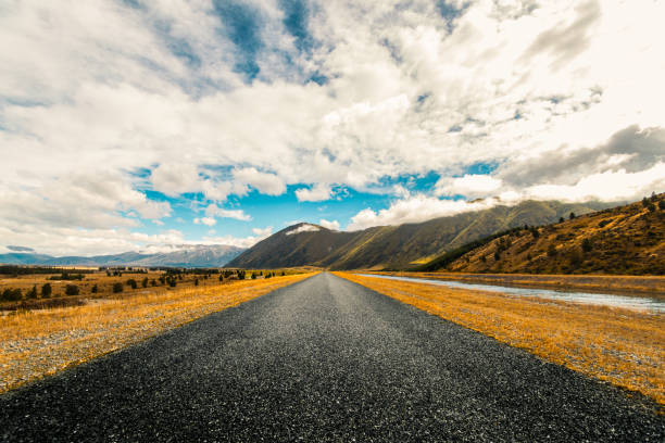 Picturesque landscape scene and sunrise above road