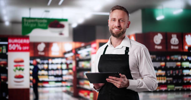 istock Supermarket Store Trainee Employee. Happy Man 2185697204