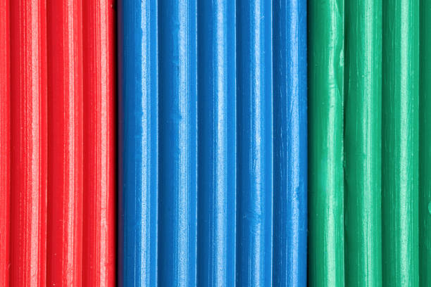 Artistic plastic clay for modeling in a box. Children red green blue RGB plasticine modeled for learning craft. Art of modeling material close up.