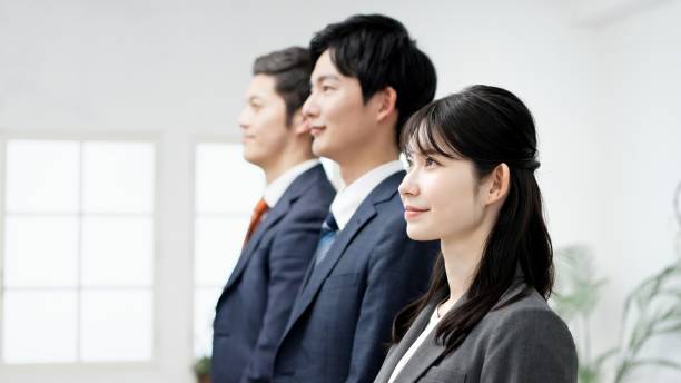 istock Smiling business person standing in the office 2185697646