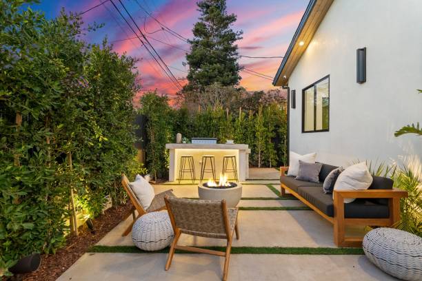 istock Modern outdoor patio with cozy seating and fire pit. 2185698579