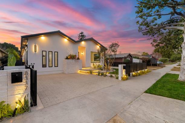 istock Modern house exterior with illuminated facade at sunset. 2185698605