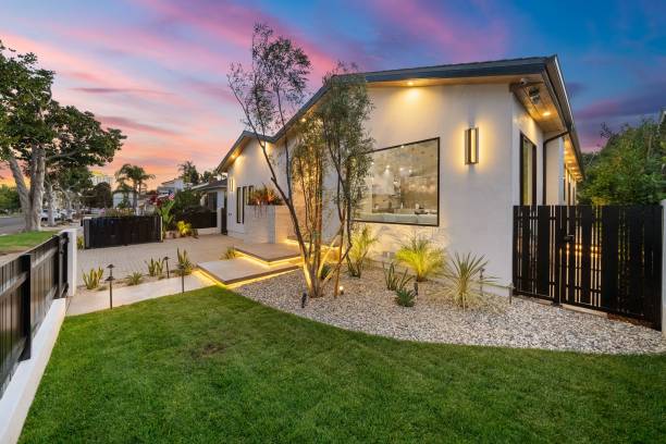 istock Modern suburban house with garden at sunset. 2185698720
