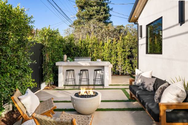 istock Modern outdoor patio with fire pit and seating. 2185699004