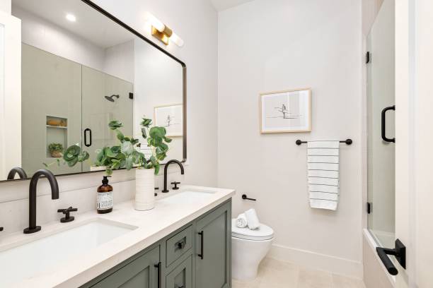 istock Modern bathroom interior with dual sinks and elegant decor. 2185699077