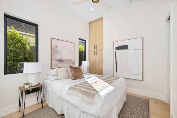 istock Modern bedroom with minimalist decor and abstract art. 2185699123