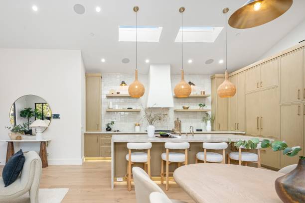 istock Modern kitchen interior with wooden cabinets and skylights. 2185699135