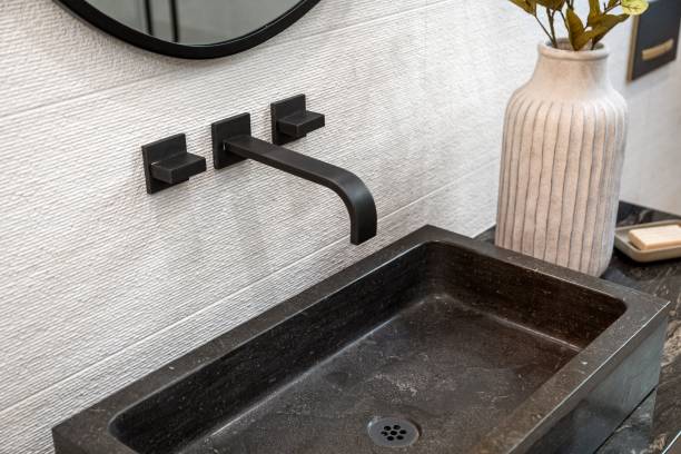 istock Modern bathroom sink with black faucet 2185699188