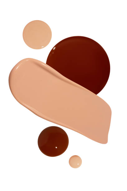 istock Composition of liquid foundation smears and drops in various shades, including light and dark tones, isolated on a blank background. 2185700169