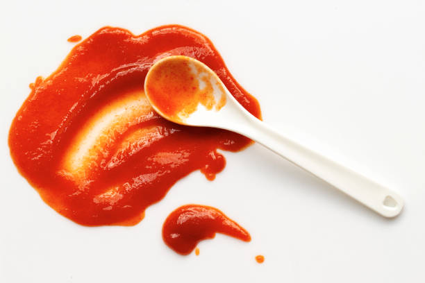 istock white spoon on chili sauce 2185700370