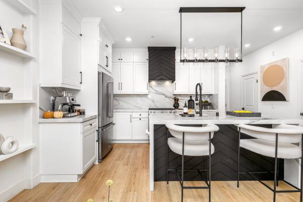 istock Modern kitchen interior with white cabinets and marble countertops. 2185701772