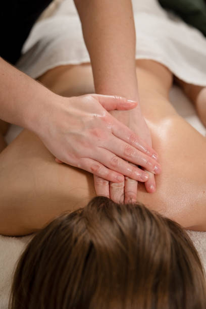 istock Therapist performing back massage with hands on a relaxed patient. Wellness and relaxation concept 2185702246