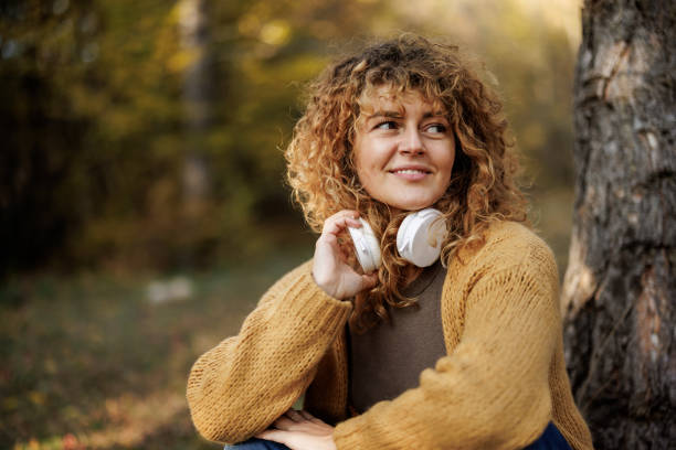 istock In harmony with beautiful autumn nature around her 2185703263