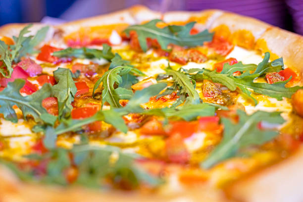 vegetarian pizza with green arugula and double cheese. snack