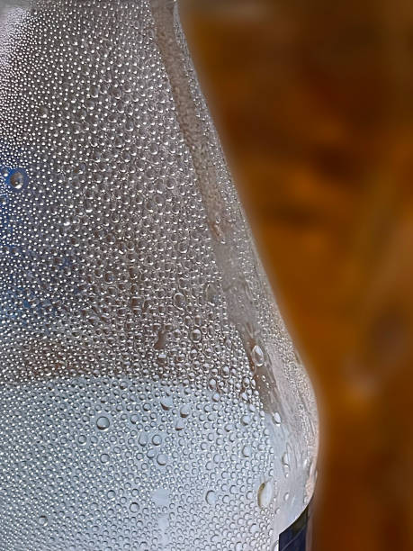istock Closeup of condensation, water droplets, moisture formed on a plastic beverage bottle. 2185706877