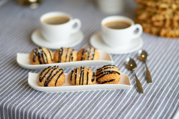 istock Butter orange cookies with dark chocolate drizzle glaze on a table served 2185707157