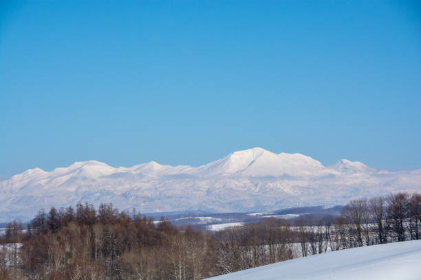istock Snow hills and mountains with the blue sky 2185708831
