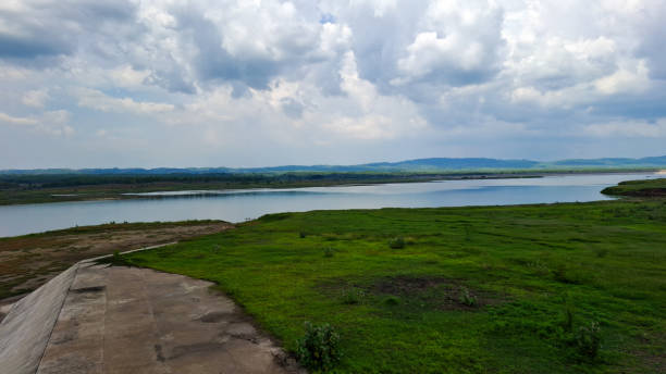 istock A tranquil scene of a calm lake surrounded by lush greenery 2185710578