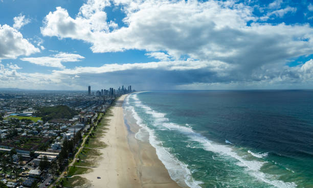 Explore the breathtaking aerial view of the beach, Pacific Ocean, and skyscrapers at Gold Coast, Australia. This stunning image captures the vibrant coastal city, blending natural beauty with urban sophistication.
