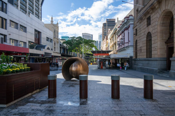 The Former Treasury Building seen to the right in the image, in downtown Brisbane, is a grand 19th-century sandstone landmark, now housing a casino and hotel.