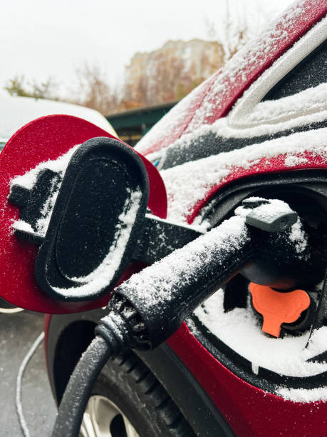 istock Electric car charging in winter snow covered environment 2185718074