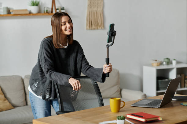 istock Young woman creating engaging content in a cozy home office space with a modern vibe 2185718285