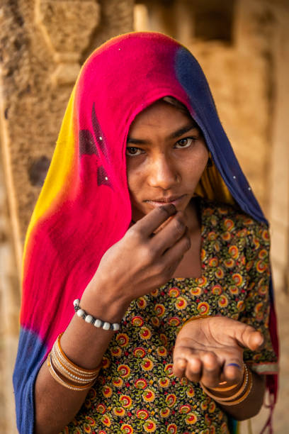 istock Poor Indian girl asking for help 2185719438