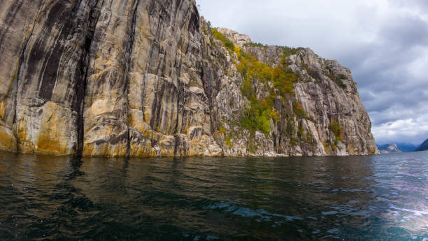 istock Steep Rocky Cliff by Calm Waters 2185719667