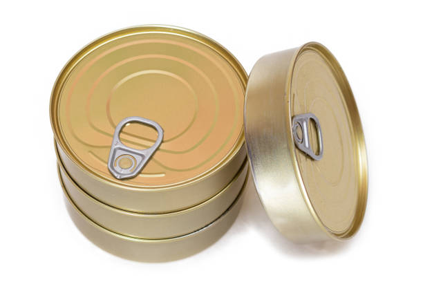 A Group of Stacked Tin Cans with Blank Edges Isolated on White Background. Canned Food. Different Aluminum Cans for Safe and Long Term Storage of Food. Steel Sealed Food Storage Containers - Isolation