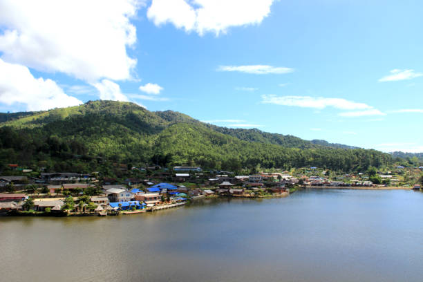 istock Natural tourist attractions with a large river, trees, and a bright sky background. 2185722403