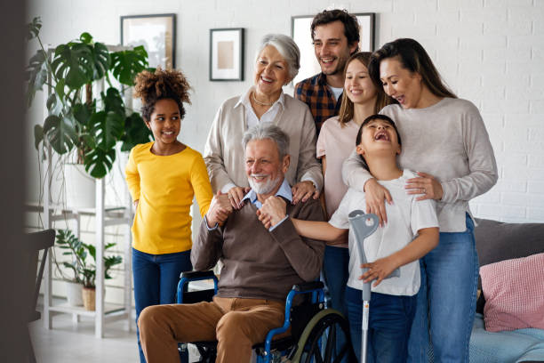 istock Multi generation, multiethnic family at home together, grandfather with disability 2185722470