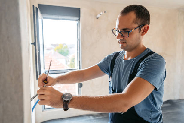 istock Electrician Working With Electric Cables In An Empty Apartment Under Renovation 2185722715