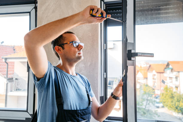 istock Repairman Screwing The Windows In An Empty Apartment Under Renovation 2185722951