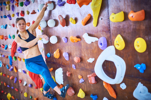 istock Skilled climber demonstrates technique on colorful indoor climbing wall during training session 2185723110