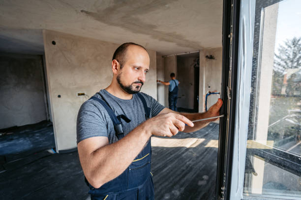 istock Repairman Screwing The Windows In An Empty Apartment Under Renovation 2185723727