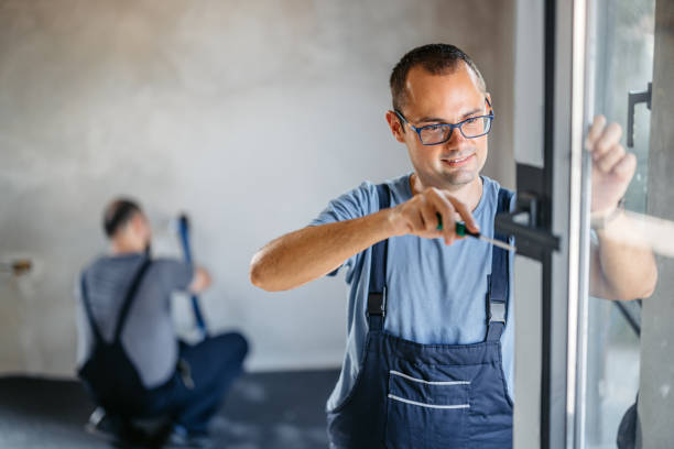 istock Repairman Screwing The Windows In An Empty Apartment Under Renovation 2185723878