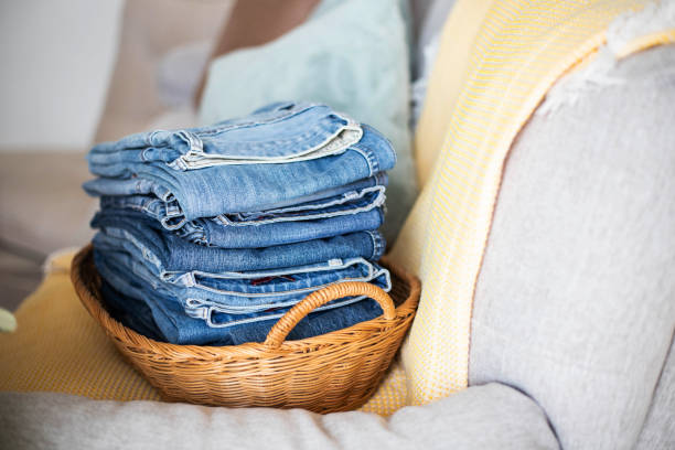 High angle view of a blue jeans stack isolated on white background